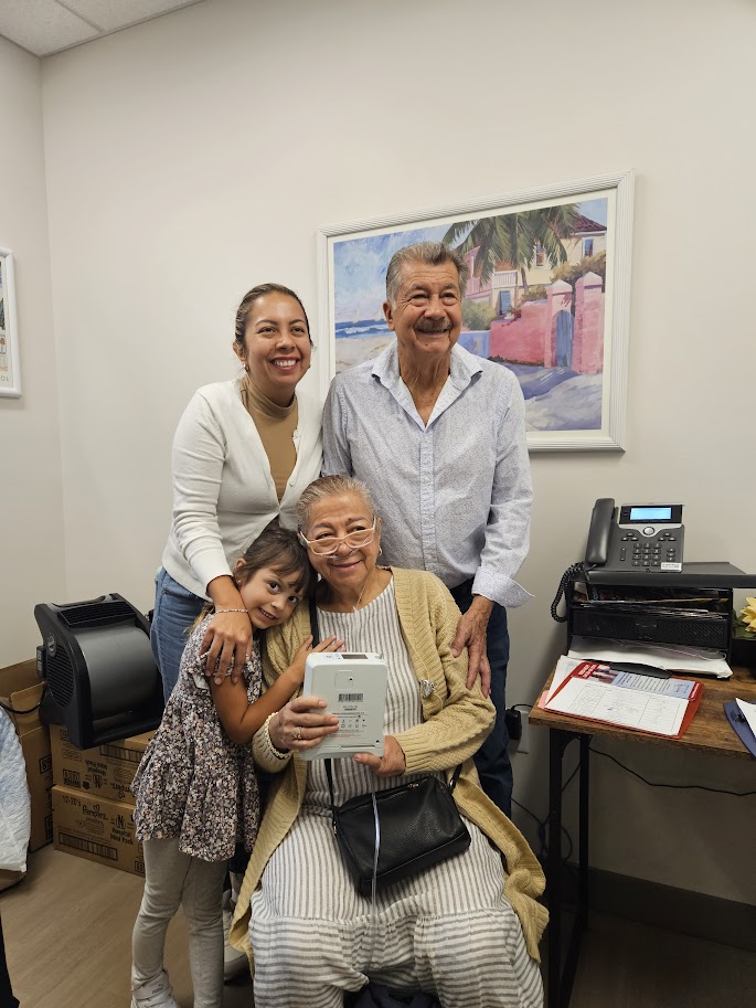 Nancy with her portable oxygen concentrator at the CRC office